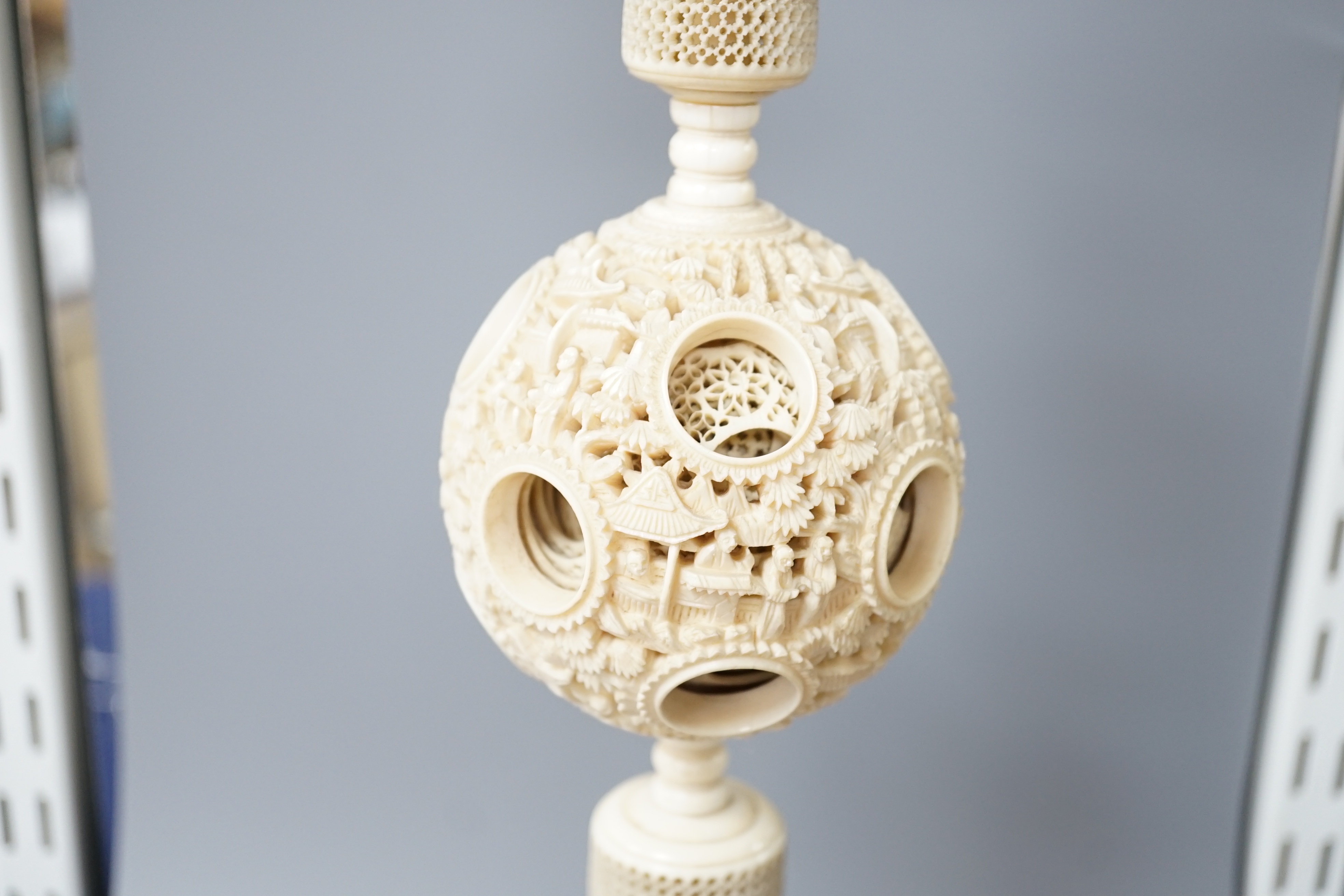 A boxed 19th century Chinese ivory concentric puzzle ball 41cm